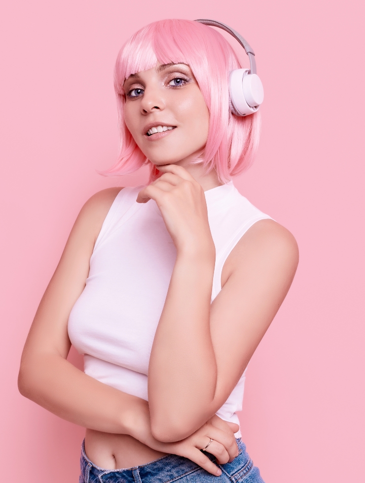 portrait gorgeous woman with pink hair enjoys music headphones